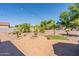 Outdoor patio space with fire pit and string lights at 40350 W Art Pl, Maricopa, AZ 85138