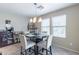 Small dining area with a table and four chairs at 40350 W Art Pl, Maricopa, AZ 85138