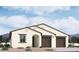 New construction home with three-car garage and desert landscaping at 2622 E Homesteader Rd, San Tan Valley, AZ 85140