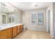 Double vanity bathroom with large mirror and tile flooring at 3625 S Payton --, Mesa, AZ 85212