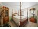 Charming bedroom with wooden four-poster bed and plenty of natural light at 20132 W Medlock Dr, Litchfield Park, AZ 85340