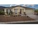 Beautiful ranch-style home with landscaping and two-car garage at 3035 W Thurman Dr, Laveen, AZ 85339