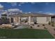 Large backyard with patio, seating area, and grass at 3035 W Thurman Dr, Laveen, AZ 85339