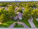 Two-story home with a circular driveway and lush landscaping at 902 E San Angelo Ave, Gilbert, AZ 85234