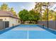 Blue paddle tennis court, view from the side at 902 E San Angelo Ave, Gilbert, AZ 85234