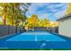 Private paddle tennis court with blue surface at 902 E San Angelo Ave, Gilbert, AZ 85234