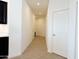 Clean hallway with light-colored tile floors and neutral walls at 2511 W Queen Creek Rd # 417, Chandler, AZ 85248