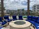 Fire pit with blue couches and pool view at 2511 W Queen Creek Rd # 417, Chandler, AZ 85248