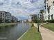 Community with a canal walkway and fountain at 2511 W Queen Creek Rd # 417, Chandler, AZ 85248
