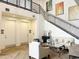 Lobby area with seating, staircase, and art at 2511 W Queen Creek Rd # 417, Chandler, AZ 85248