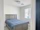 Cozy bedroom with gray bed frame and blue bedding at 2511 W Queen Creek Rd # 417, Chandler, AZ 85248
