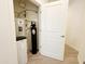 Water heater and water softener in a utility closet at 2511 W Queen Creek Rd # 417, Chandler, AZ 85248