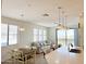 Bright dining area with table and chairs, adjacent to living room and kitchen at 2511 W Queen Creek Rd # 417, Chandler, AZ 85248