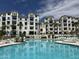Resort-style pool with plenty of lounge chairs and a hot tub at 2511 W Queen Creek Rd # 417, Chandler, AZ 85248