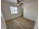 Spacious bedroom with ceiling fan and wood floors at 2616 E Southgate Ave # 2, Phoenix, AZ 85040