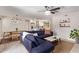 Open living room and kitchen area with a blue couch and dining table at 2520 E Flower St, Phoenix, AZ 85016