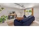 Living room features a sectional sofa and a large TV at 2520 E Flower St, Phoenix, AZ 85016