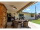 Covered patio features a dining area and built in bar at 2520 E Flower St, Phoenix, AZ 85016