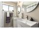 Clean bathroom with double sinks, updated vanity, and large mirror at 2520 E Flower St, Phoenix, AZ 85016