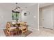 Bright dining area with rustic wooden table and modern chairs at 2520 E Flower St, Phoenix, AZ 85016