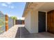 Side yard with gravel landscaping and a modern wall at 2520 E Flower St, Phoenix, AZ 85016