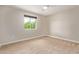 Bright bedroom with neutral walls and plush carpeting at 2520 E Flower St, Phoenix, AZ 85016