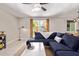 Spacious living room with comfortable sectional sofa and access to backyard at 2520 E Flower St, Phoenix, AZ 85016