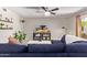Cozy living room with sectional sofa, TV, and built-in shelving at 2520 E Flower St, Phoenix, AZ 85016