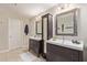 Modern bathroom with double vanity and mosaic mirror at 2520 E Flower St, Phoenix, AZ 85016