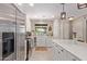 Modern kitchen with stainless steel appliances and white cabinets at 2520 E Flower St, Phoenix, AZ 85016