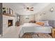 Spacious main bedroom with fireplace, large bed, and plenty of light at 2520 E Flower St, Phoenix, AZ 85016