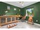 Home office with green walls, stylish furniture, and hexagon tile floor at 2520 E Flower St, Phoenix, AZ 85016