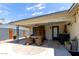 Outdoor patio space with a dining table and built-in bar at 2520 E Flower St, Phoenix, AZ 85016