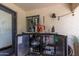 Outdoor bar with beer taps, refrigerator, and ample storage at 2520 E Flower St, Phoenix, AZ 85016