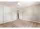 Well-lit bedroom featuring double door closet and carpet flooring at 2520 E Flower St, Phoenix, AZ 85016