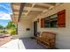 Front porch with wooden bench and brick facade at 2520 E Flower St, Phoenix, AZ 85016