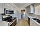 Updated kitchen with stainless steel appliances and quartz countertops at 3013 W Hearn Rd, Phoenix, AZ 85053