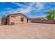 Large backyard with gravel and block wall at 285 W Santa Gertrudis Trl, San Tan Valley, AZ 85143