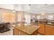 Kitchen boasts granite countertops and an island with breakfast bar seating at 15954 N 162Nd Ln, Surprise, AZ 85374