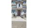 Front entrance of a modern townhouse with a brown door at 639 W Pepper Pl # 109, Mesa, AZ 85201