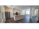 Modern kitchen with white cabinets and island at 639 W Pepper Pl # 109, Mesa, AZ 85201
