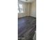 Bright bedroom with hardwood floors and large window at 639 W Pepper Pl # 109, Mesa, AZ 85201