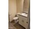 Bathroom with vanity, toilet, and gray tile floor at 639 W Pepper Pl # 102, Mesa, AZ 85201