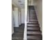Modern staircase with dark gray wood-look flooring at 639 W Pepper Pl # 102, Mesa, AZ 85201