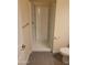 Clean bathroom with a shower and gray tile floor at 639 W Pepper Pl # 102, Mesa, AZ 85201