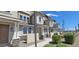 Modern townhome with light-colored siding and stone accents at 639 W Pepper Pl # 102, Mesa, AZ 85201