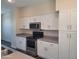 Modern kitchen with white cabinets and stainless steel appliances at 639 W Pepper Pl # 102, Mesa, AZ 85201
