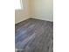 Spacious bedroom featuring dark gray vinyl flooring at 639 W Pepper Pl # 102, Mesa, AZ 85201