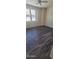 Bright bedroom with gray flooring and large windows at 639 W Pepper Pl # 107, Mesa, AZ 85201