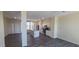 Open concept kitchen and living area with gray flooring at 639 W Pepper Pl # 107, Mesa, AZ 85201